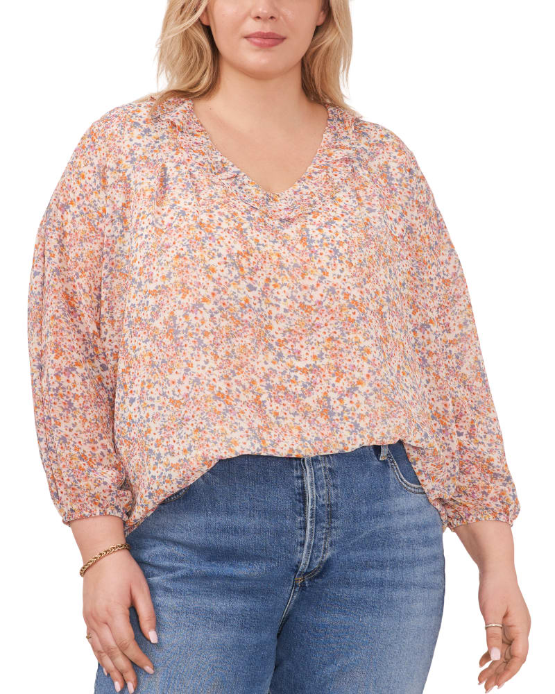 Front of a model wearing a size 0X Charlotte Ruffle V-Neck Top in SWEET BLOOMS by 1.State. | dia_product_style_image_id:262092